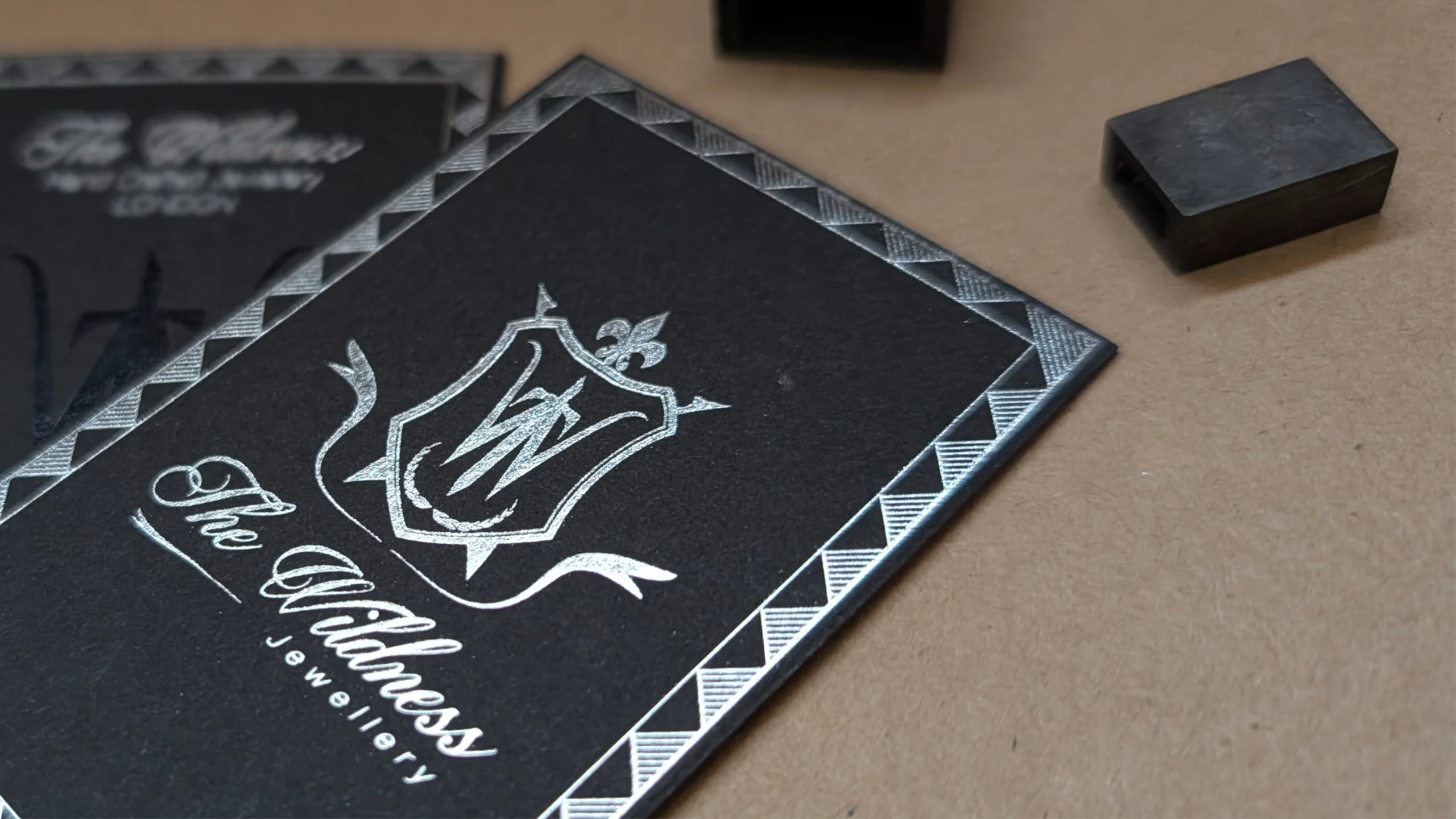 black business card printed with silver foil